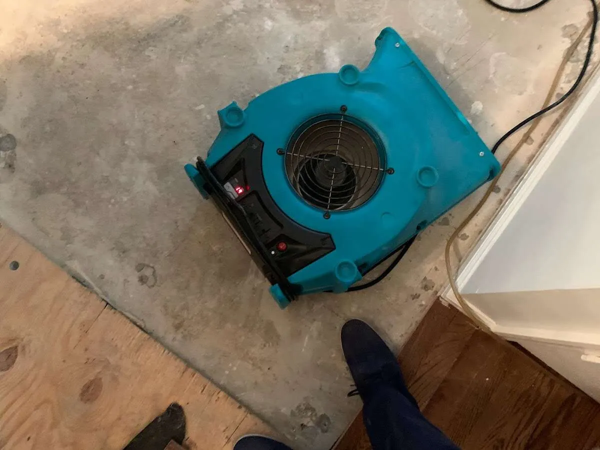 Air mover drying subfloor during Leak Detection & Repair in Upper Hanover